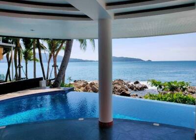 Outdoor area with pool and ocean view