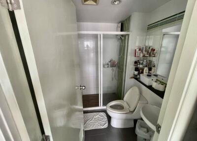 Modern bathroom with shower, toilet, and sink