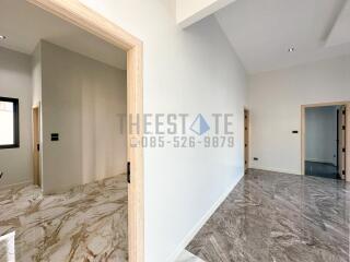 Spacious and well-lit hallway with marble flooring