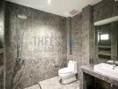 Modern bathroom with marble tiles and walk-in shower