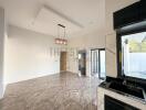 Modern living area with marble floor and large windows