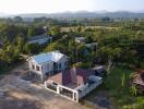 Aerial view of a residential property and surrounding landscape