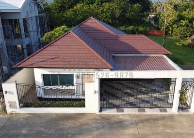 Front view of a house with a brown roof