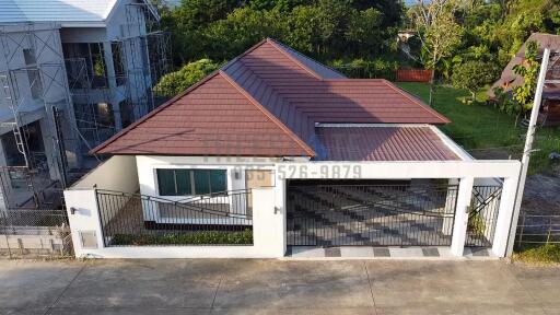 Front view of a house with a brown roof