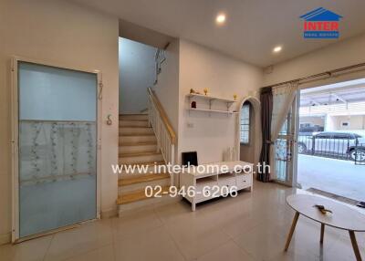 Modern living room with stairs to the upper floor