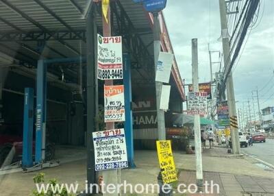 Commercial building with signs and contact information in an urban area