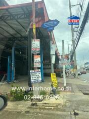 Commercial building with signs and contact information in an urban area