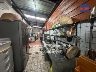 Modern industrial kitchen with ample storage and counter space.