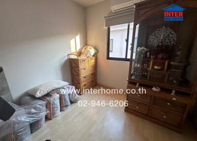 Neat bedroom with wooden furniture and natural light