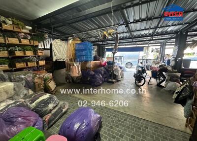 Storage area in a building with various items and a motorcycle