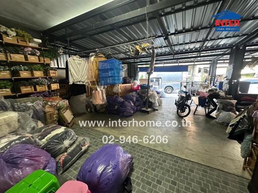 Storage area in a building with various items and a motorcycle