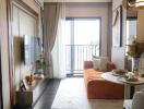 Cozy living room with orange sofa and balcony view