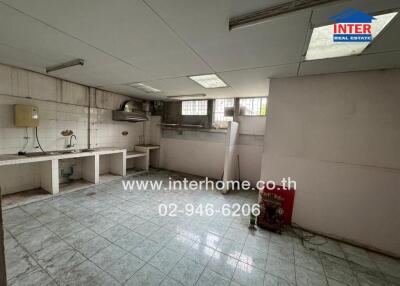 Basic kitchen with tiled floor and countertops