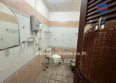 Bathroom with shower area and toilet