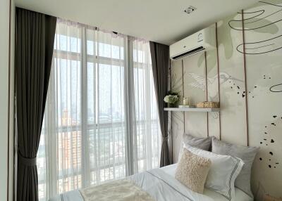 Cozy bedroom with large window and elegant decor