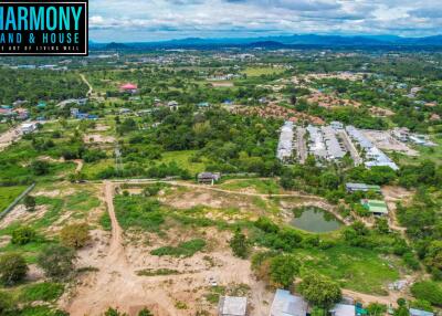 Aerial view of a property land area and its surroundings