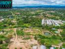 Aerial view of a property land area and its surroundings