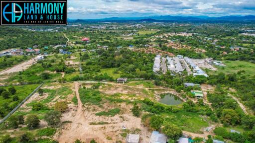 Aerial view of a property land area and its surroundings