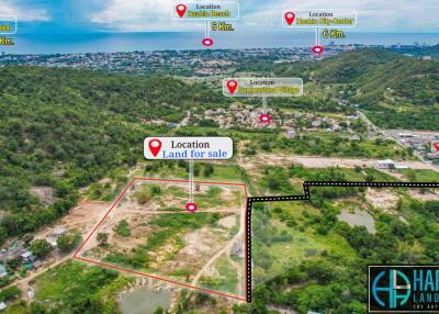 Aerial view of property land for sale with landmarks and distances indicated