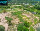 Aerial view of a vast plot of land with surrounding greenery