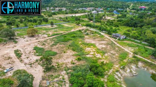 Aerial view of a vast plot of land with surrounding greenery