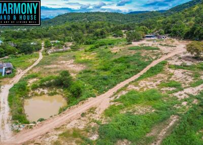 Aerial view of a large expanse of land with natural greenery