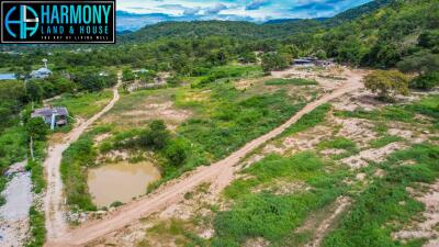 Aerial view of a large expanse of land with natural greenery