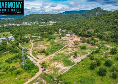 Aerial view of undeveloped land with hills and trees