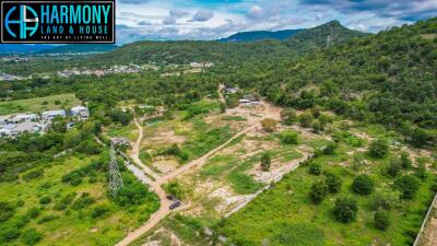 Aerial view of undeveloped land with hills and trees