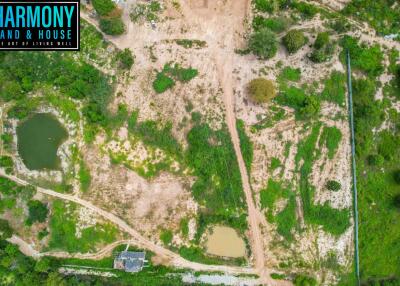 Aerial view of undeveloped land with water features