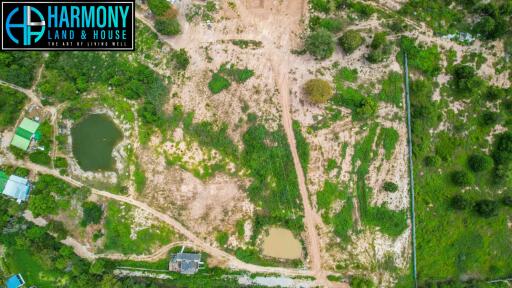 Aerial view of undeveloped land with water features