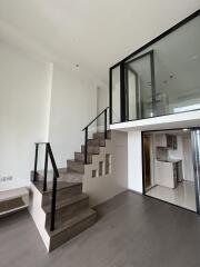 Modern living room with mezzanine and staircase