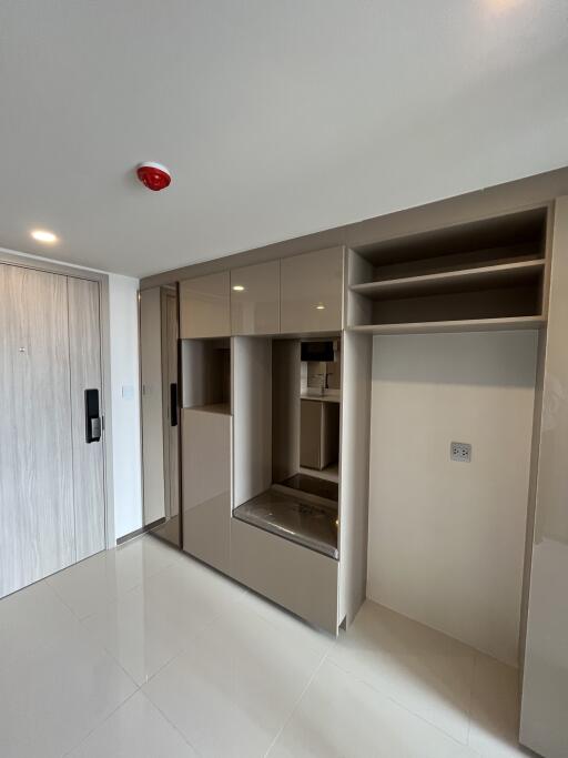 Entrance with built-in storage and cabinetry