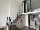 Modern duplex with kitchen and staircase to upper level