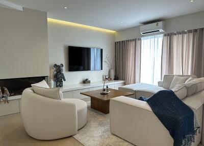 Modern living room with white furniture and decorative items