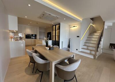 Modern kitchen and dining area with staircase