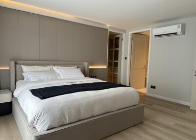 Spacious and modern bedroom with a large bed