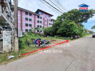 Apartment building with greenery and parked motorcycles