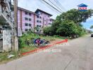 Apartment building with greenery and parked motorcycles