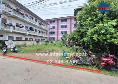 Apartment building complex with motorbikes parked outside