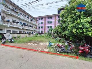 Apartment building complex with motorbikes parked outside