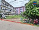 Apartment building complex with motorbikes parked outside