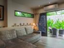 Comfortable living room with garden view through large glass doors