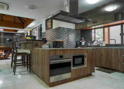 Modern kitchen with wooden cabinetry and stainless steel appliances