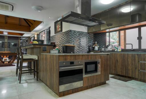 Modern kitchen with wooden cabinetry and stainless steel appliances