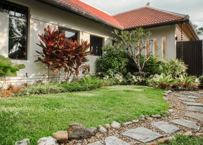 Well-maintained house exterior with garden