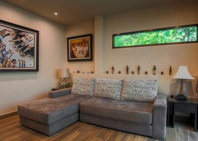 Cozy living room with sectional sofa and art on the walls