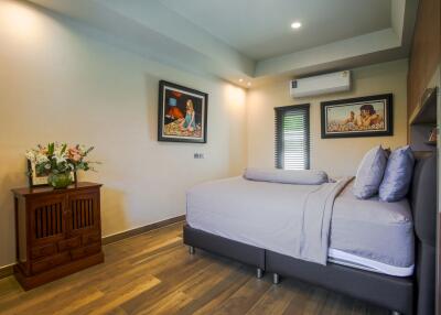 Spacious bedroom with modern design and comfortable bedding