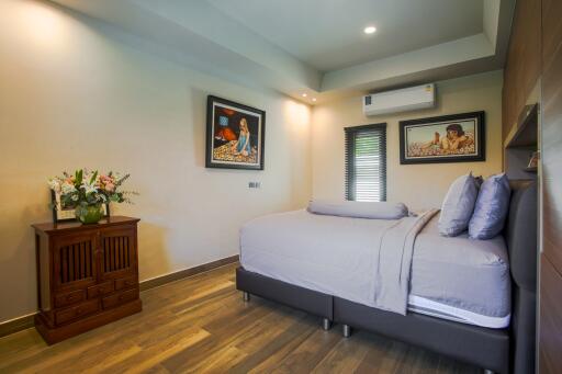 Spacious bedroom with modern design and comfortable bedding