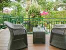 Outdoor patio with wicker furniture and garden view